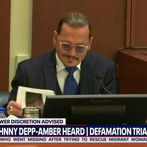 Court crack-up: Johnny Depp amused over tabloid stories, makes gallery laugh