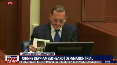 Court crack-up: Johnny Depp amused over tabloid stories, makes gallery laugh
