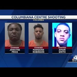 Two men charged, one wanted for attempted murder in mall shooting