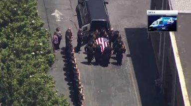 Procession delivers remains of deputy killed in line of duty to mortuary
