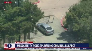 Wild police chase: GTA driver plows through gate, tries to hide behind AC